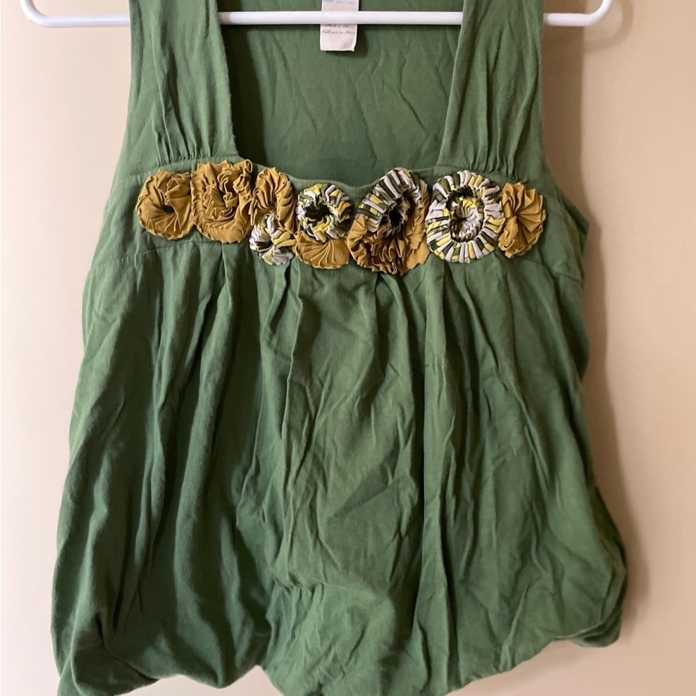 Green top with floral accents